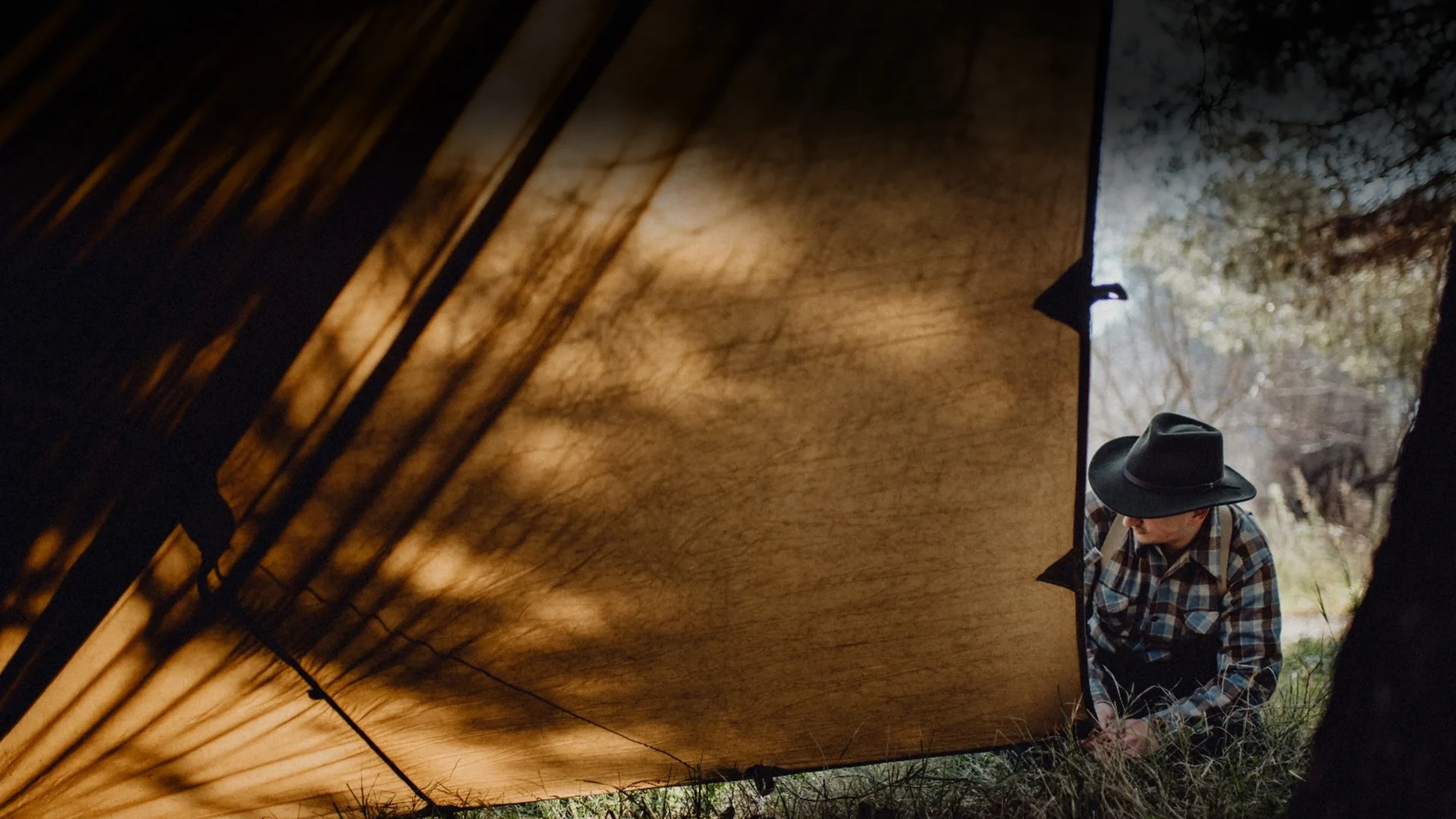 Life under an oilskin shelter in the woods