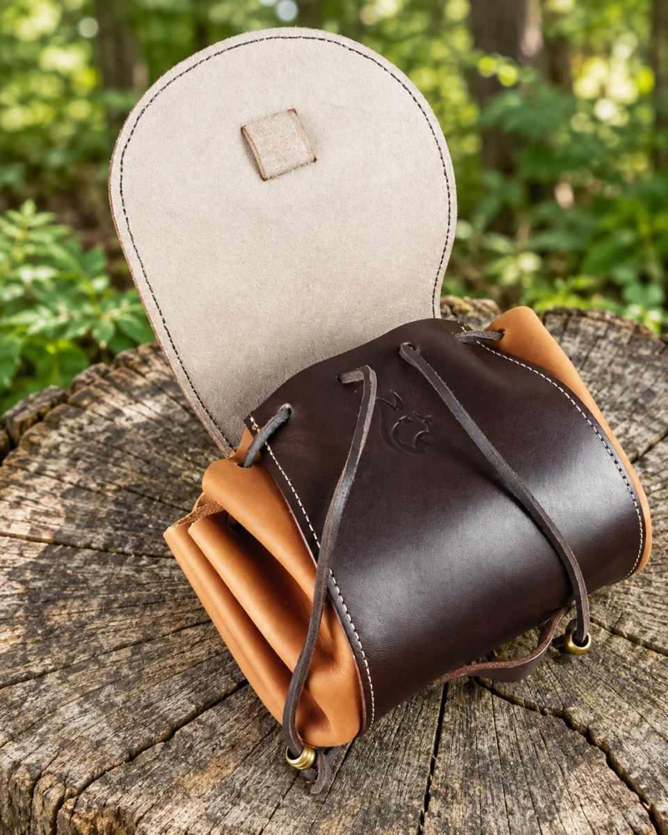 Celtic leather hip bag with open flap and drawstring closure