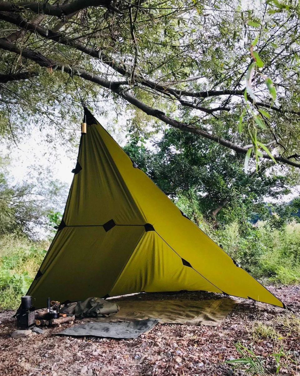 Forest Green oilskin tarp pitched in a diamond configuration