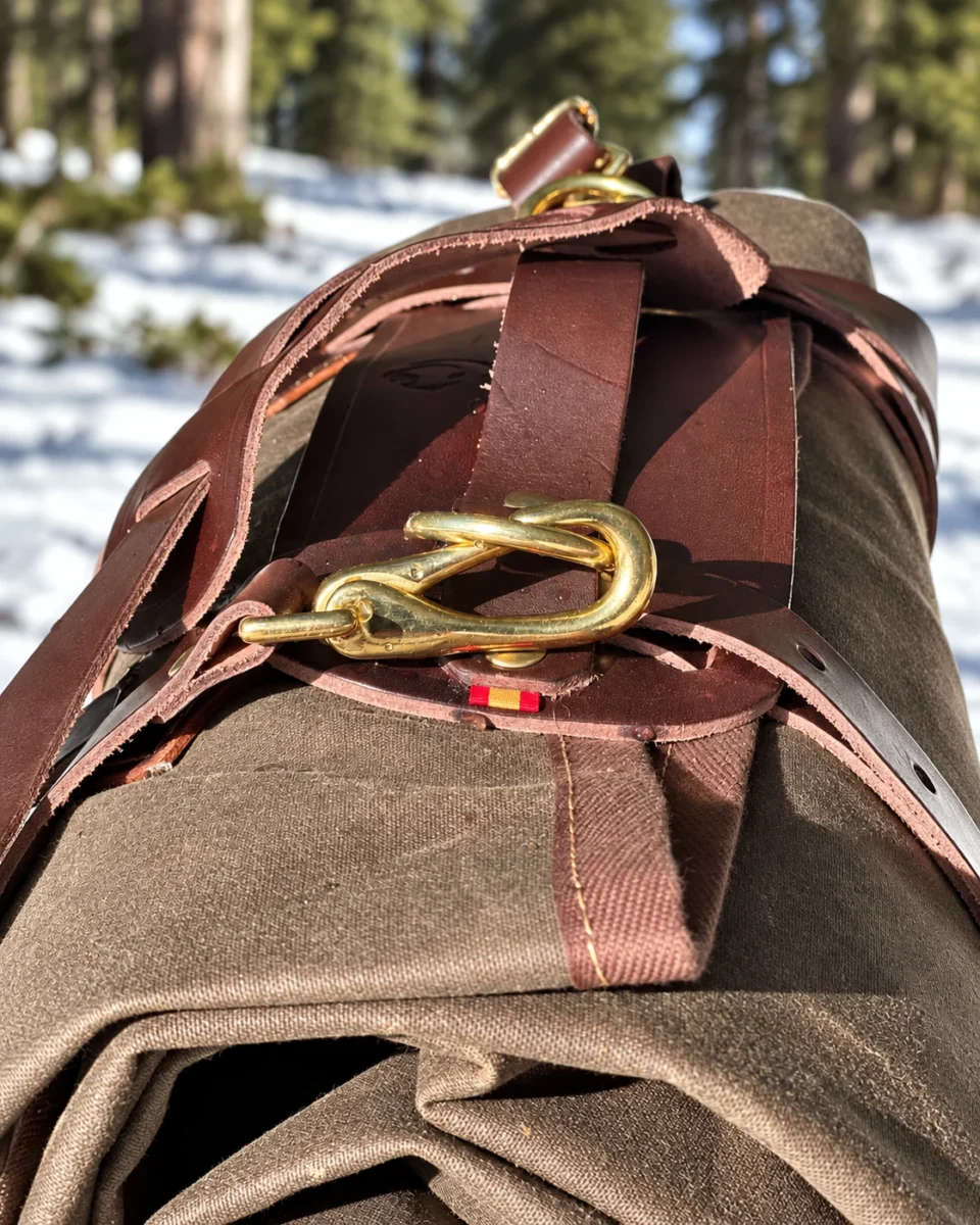Leather Carrier brass clip and shoulder strap attachment detail