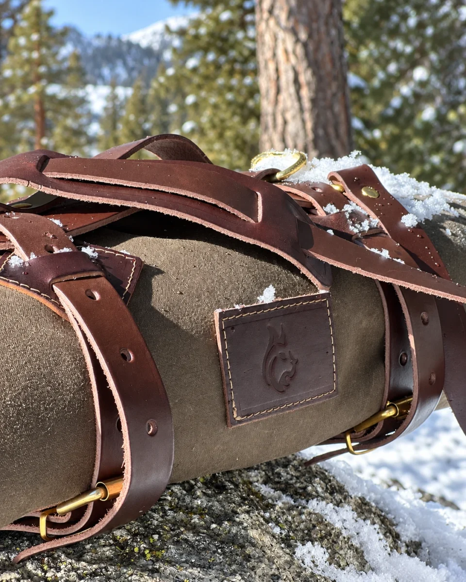 Leather Carrier handle and buckle details on a rolled oilskin tarp