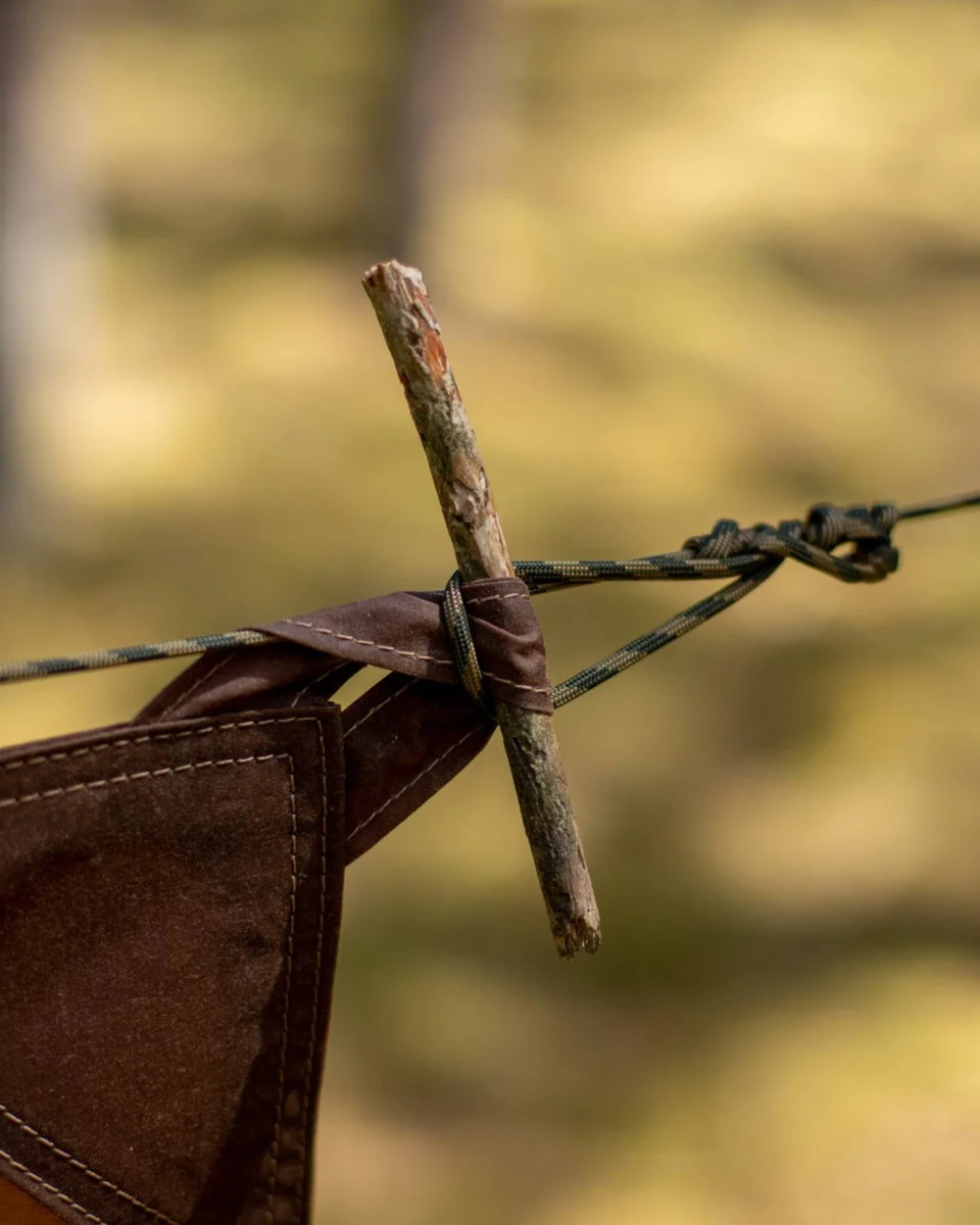 Oilskin tarp corner secured with a wooden toggle and cord
