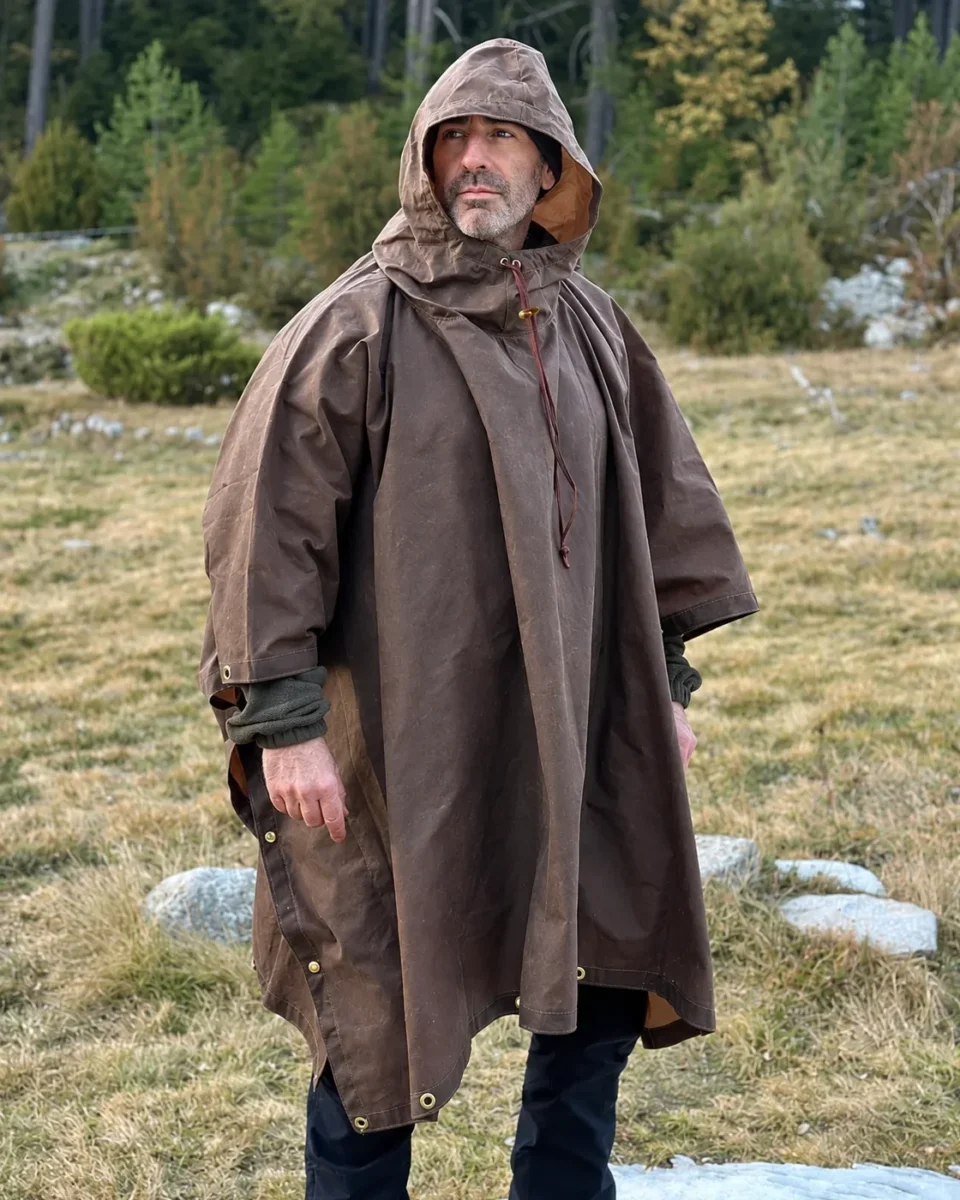 Mountain Brown Oilskin Poncho Shelter with the hood raised