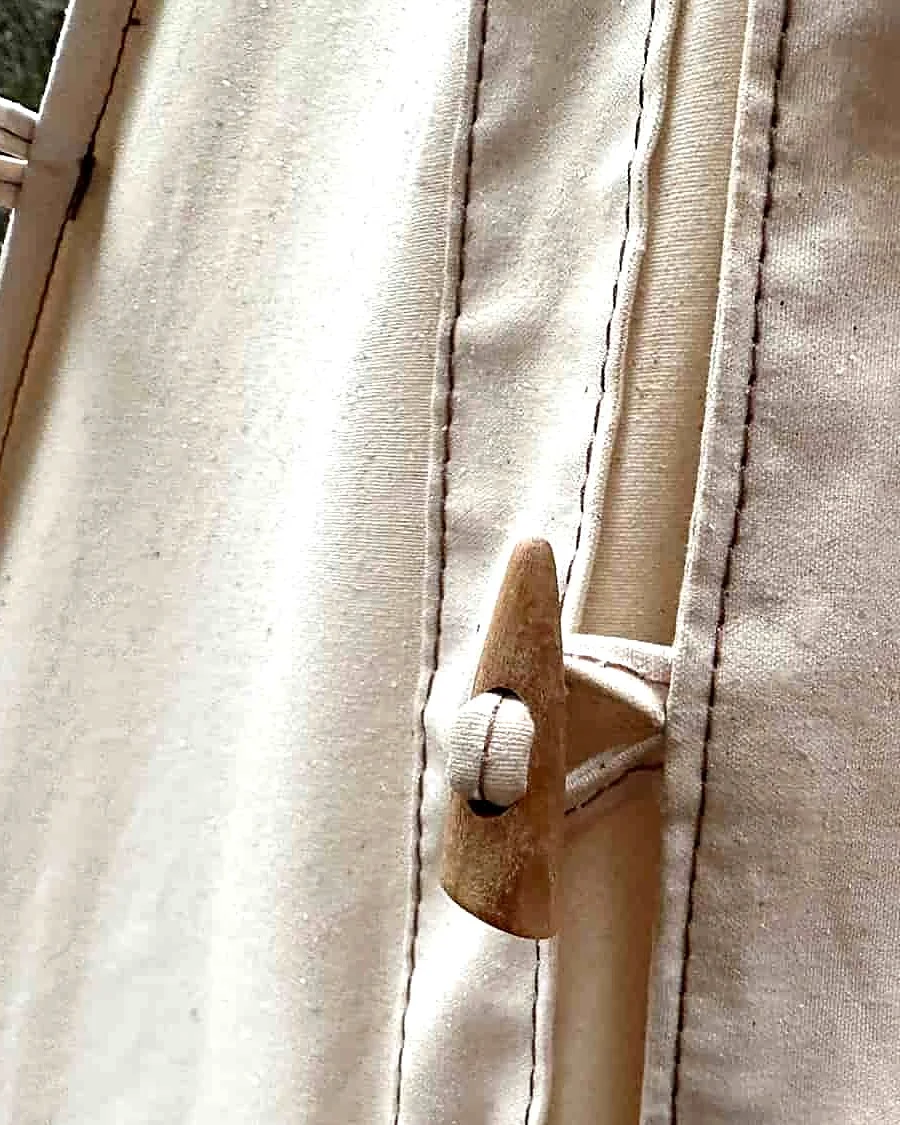 Olive-wood toggle and loop fastening on the cotton canvas tent door